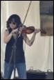 A person playing a violin

Description automatically generated