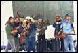 A group of people playing instruments

Description automatically generated