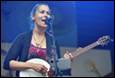 A person playing a banjo

Description automatically generated