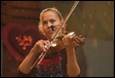 A person playing a violin

Description automatically generated