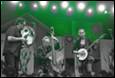 A group of people playing instruments

Description automatically generated