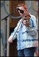 A person playing a violin

Description automatically generated