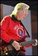 A person playing a guitar

Description automatically generated