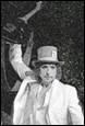 A person wearing a top hat

Description automatically generated