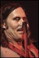 A person with long hair holding a microphone

Description automatically generated with medium confidence