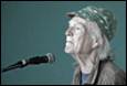 A picture containing microphone, human face, clothing, person

Description automatically generated