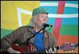 A person playing guitar and singing

Description automatically generated with low confidence