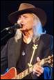 A person with a hat and guitar

Description automatically generated with low confidence