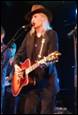 A person playing guitar on stage

Description automatically generated with low confidence
