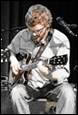 A person playing a guitar

Description automatically generated with medium confidence
