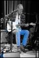 A person playing guitar and singing

Description automatically generated with low confidence