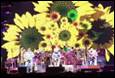 A group of people on a stage

Description automatically generated with medium confidence