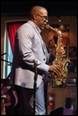 A person playing a saxophone

Description automatically generated