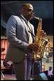 A person playing a saxophone

Description automatically generated with medium confidence
