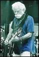 A person with a white beard playing a guitar

Description automatically generated with low confidence