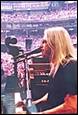 A picture containing person, clothing, concert, text

Description automatically generated