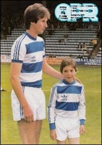 A person and child in football uniforms

Description automatically generated